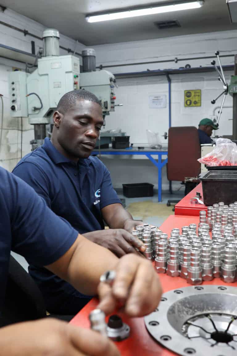 Ultra-Flow team member — assembling fittings