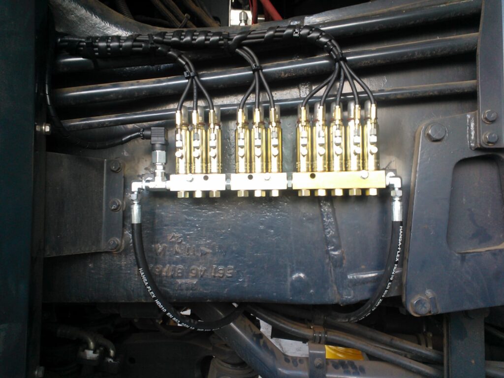 Bank of brass divider blocks mounted on a vehicle chassis