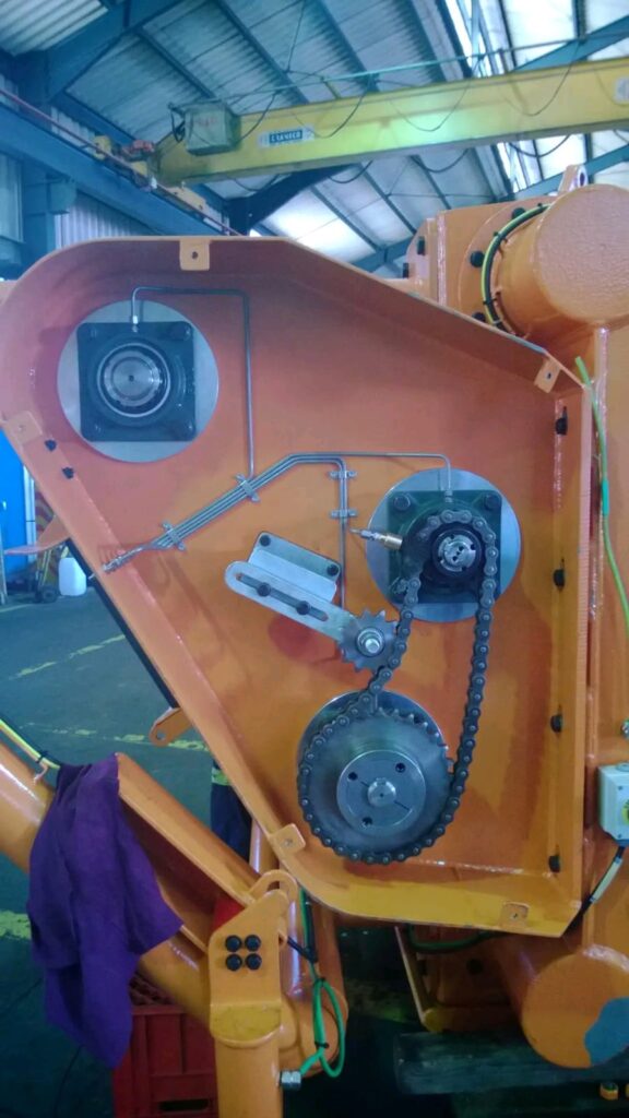 Lubrication divider block mounted on orange plant equipment
