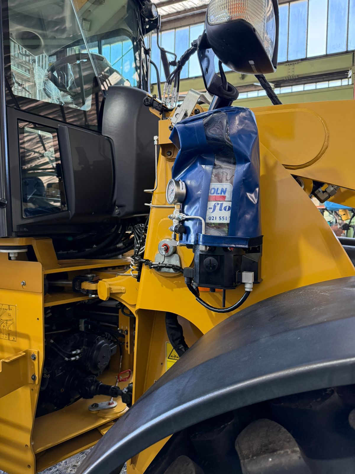 Ultra-Flow grease pump installed on a wheel loader