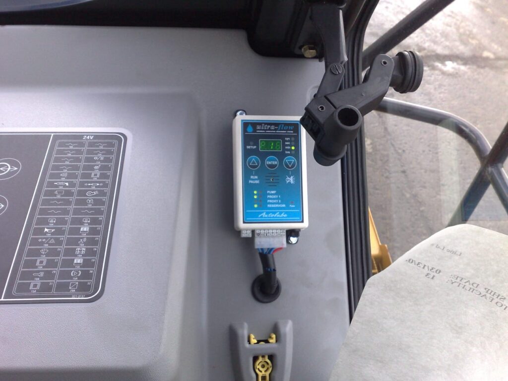 Ultra-Flow lubrication controller mounted inside an equipment cab