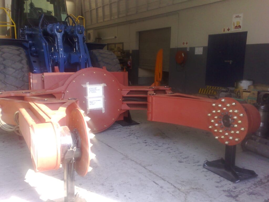 Lubrication lines routed on red heavy machinery