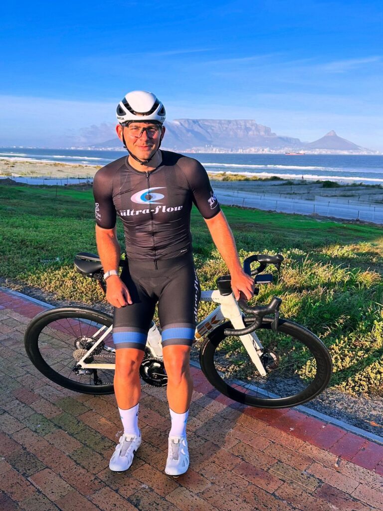 Cyclist wearing Ultra-Flow branded cycling kit